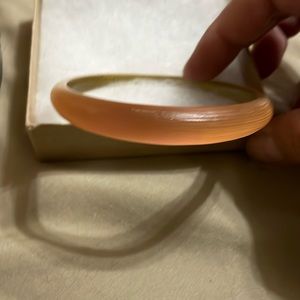 Alexis Bittar beautiful peach/pink/orange color tappered bracelet.